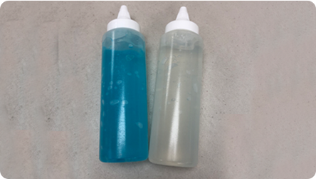 Bottles of blue and clear ultrasound gel